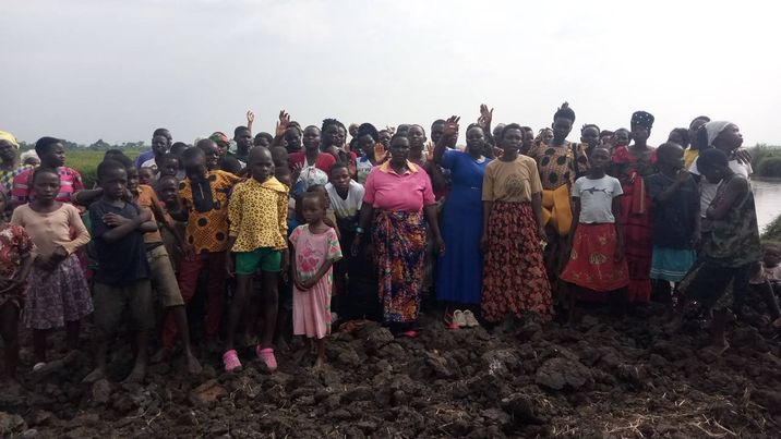 Villagers at baptismal waters